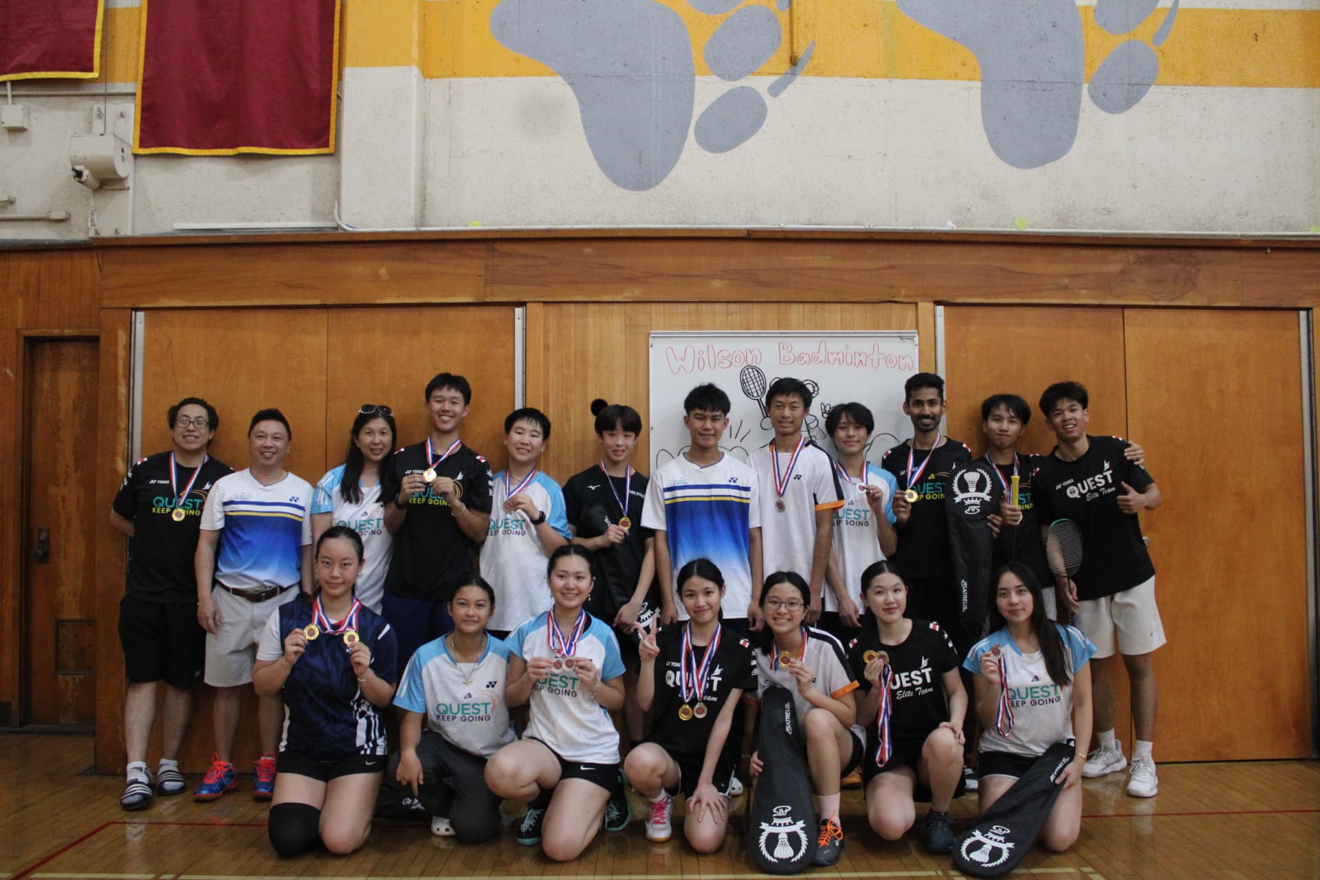 Quest Badminton team with medals after a tournament